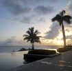 Anguilla british isle beach ocean palm trees sunset resort